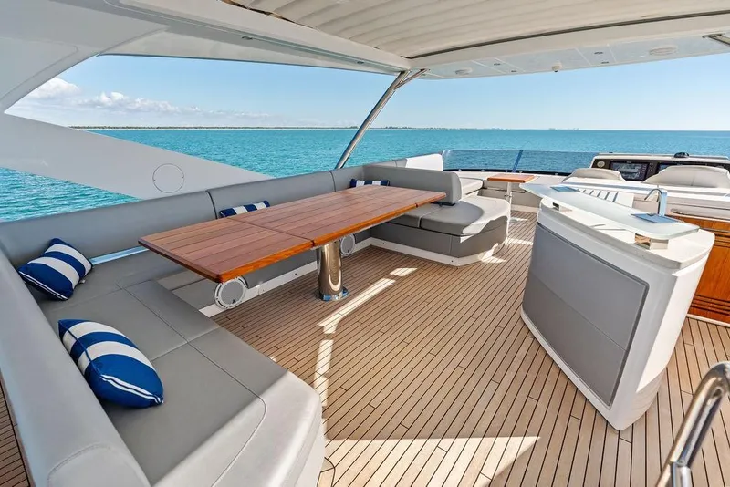 Slide: The Image of Luxurious 2019 Sunseeker 76 Yacht deck with elegant seating and ocean view. - 52