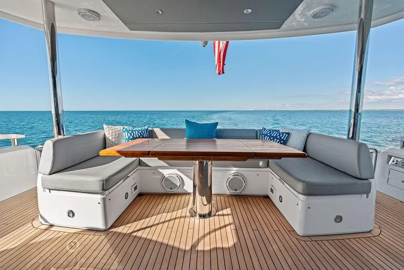 Slide: The Image of Luxurious 2019 Sunseeker 76 Yacht deck with elegant seating and ocean view. - 57