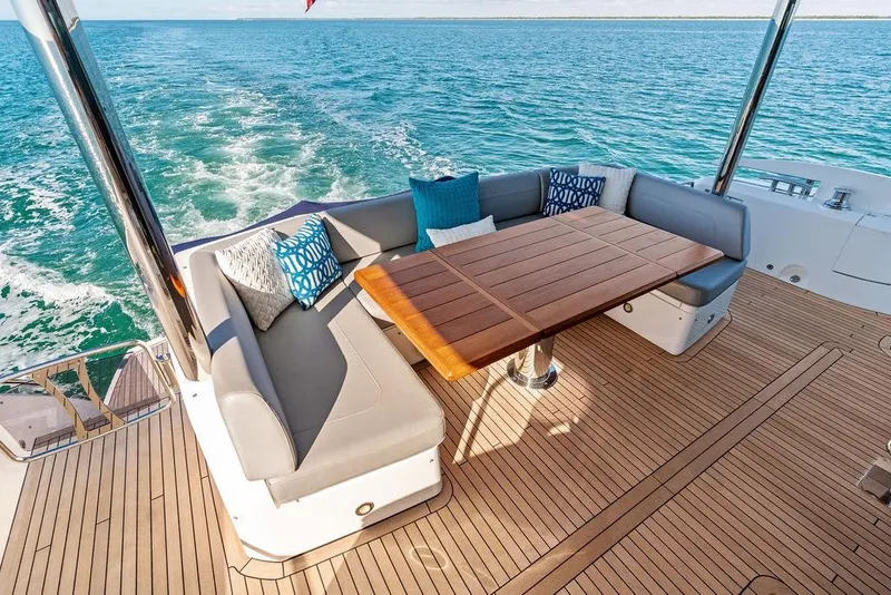 Slide: The Image of Luxurious 2019 Sunseeker 76 Yacht deck with elegant seating and ocean view. - 61