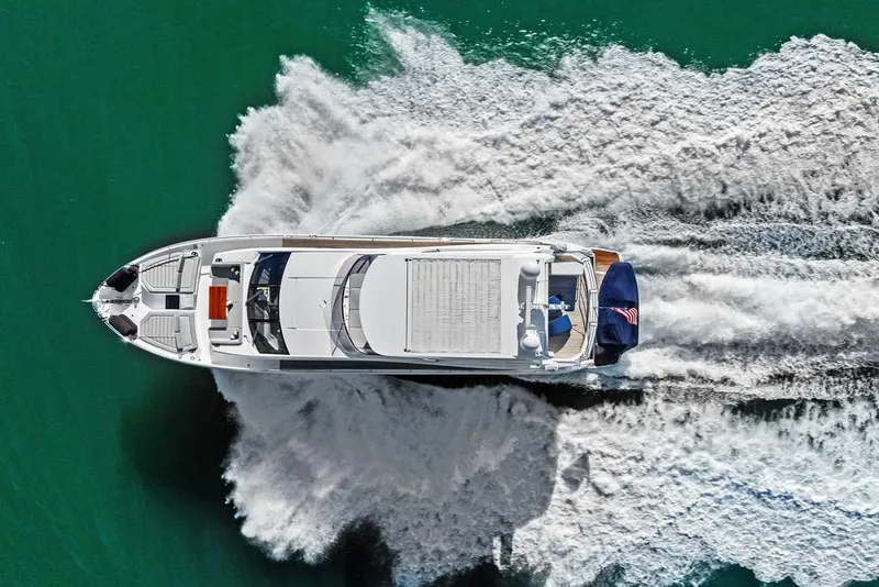 Slide: The Image of Aerial view of 2019 Sunseeker 76 Yacht cruising on turquoise water. - 68