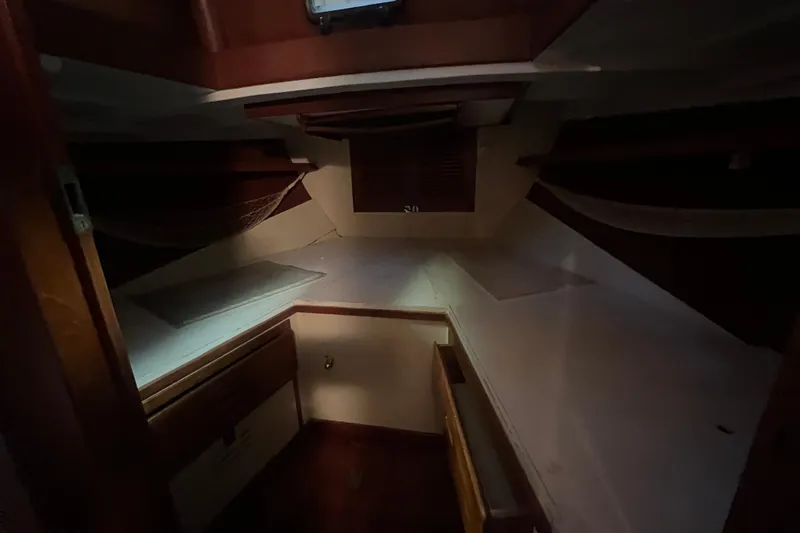 Slide: The Image of Interior cabin of 1962 Ted Hood Little Harbor 40 Yawl, featuring wooden finishes. - 13