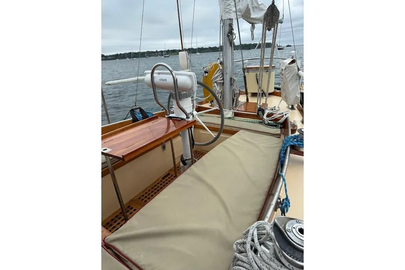 Slide: The Image of 1962 Ted Hood Little Harbor 40 Yawl sailboat deck with steering wheel and rigging. - 29