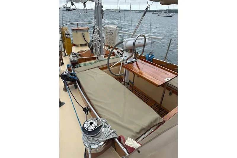 Slide: The Image of 1962 Ted Hood Little Harbor 40 Yawl sailboat deck with ropes and wooden details. - 31