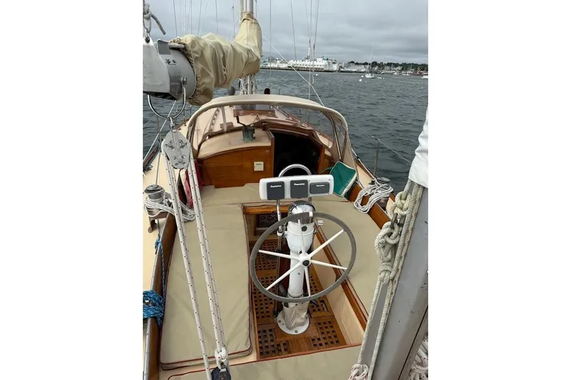Slide: The Image of 1962 Ted Hood Little Harbor 40 Yawl sailboat cockpit with steering wheel and navigation equipment. - 33