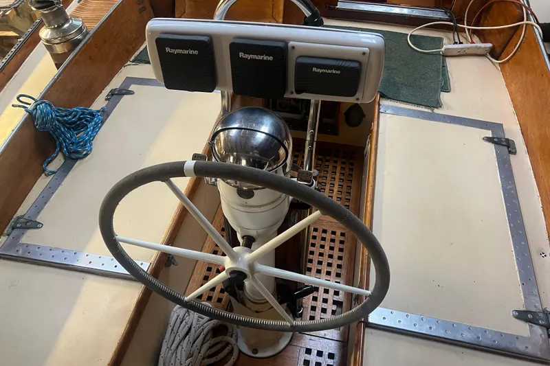 Slide: The Image of Steering wheel and navigation equipment on 1962 Ted Hood Little Harbor 40 Yawl. - 34