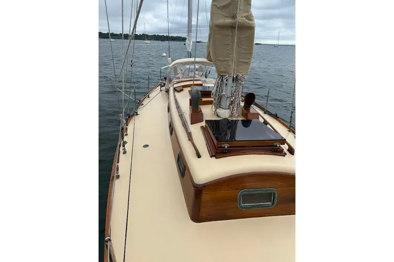 Slide: The Image of Classic 1962 Ted Hood Little Harbor 40 Yawl on calm waters, showcasing elegant deck design. - 37