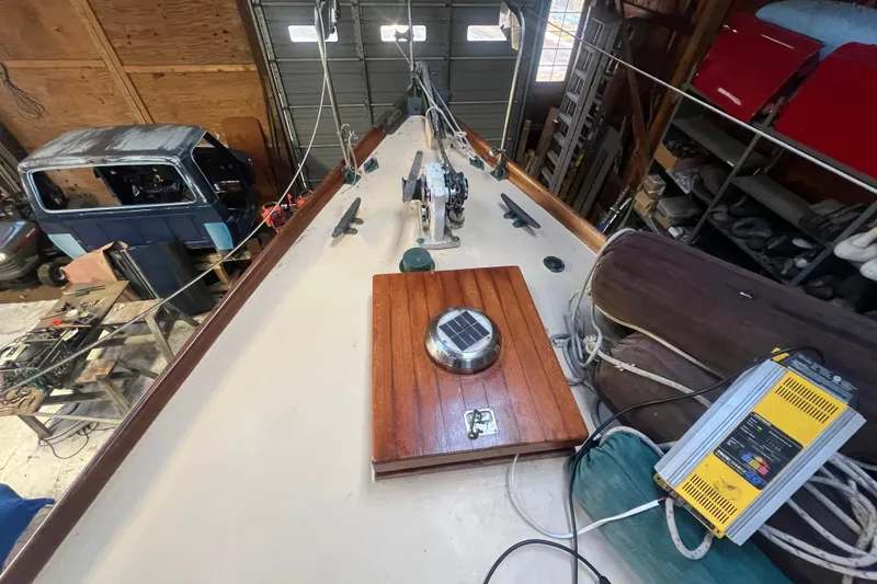 Slide: The Image of 1962 Ted Hood Little Harbor 40 Yawl in a workshop, showcasing deck details and equipment. - 42