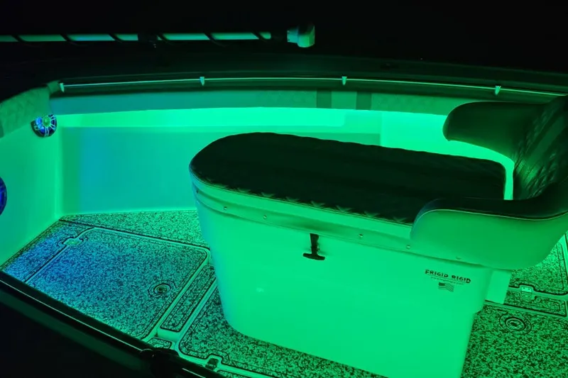 Slide: The Image of 2002 Yellowfin 31 Center Console boat interior with vibrant green LED lighting. - 9