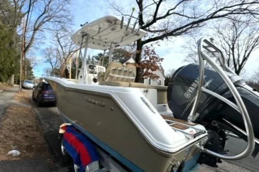 Slide: The Image of 2015 Tidewater 232 LXF boat with Yamaha engine parked on a street. - 11