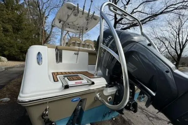 Slide: The Image of 2015 Tidewater 232 LXF boat with Yamaha outboard motor, parked outdoors. - 21
