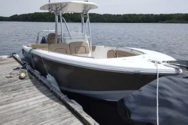 Slide: The Image of 2015 Tidewater 232 LXF boat docked on a calm lake. - 6