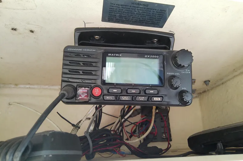 Slide: The Image of VHF radio system on 1995 Grady-White Sailfish 272 boat dashboard. - 23