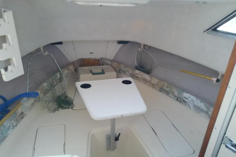 Slide: The Image of Interior of 1995 Grady-White Sailfish 272 boat with fishing nets and table. - 24