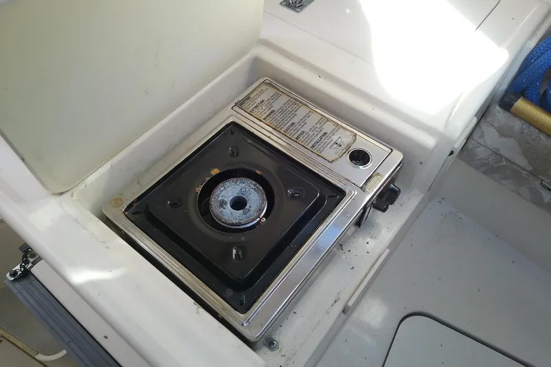 Slide: The Image of Built-in stove on 1995 Grady-White Sailfish 272 boat, featuring a compact design. - 26