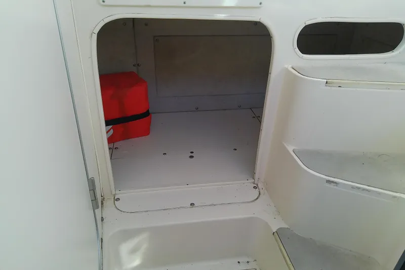 Slide: The Image of Interior cabin of 1995 Grady-White Sailfish 272 boat with red storage box. - 31