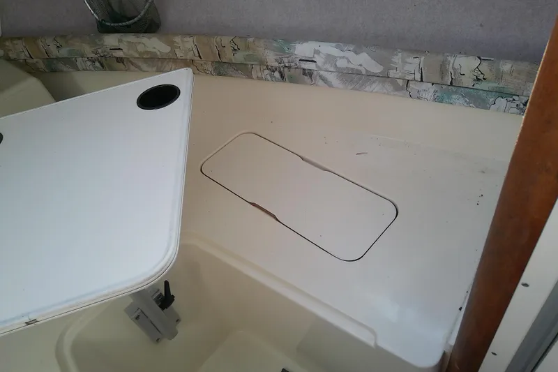 Slide: The Image of Interior view of a 1995 Grady-White Sailfish 272 boat cabin with storage compartment. - 33