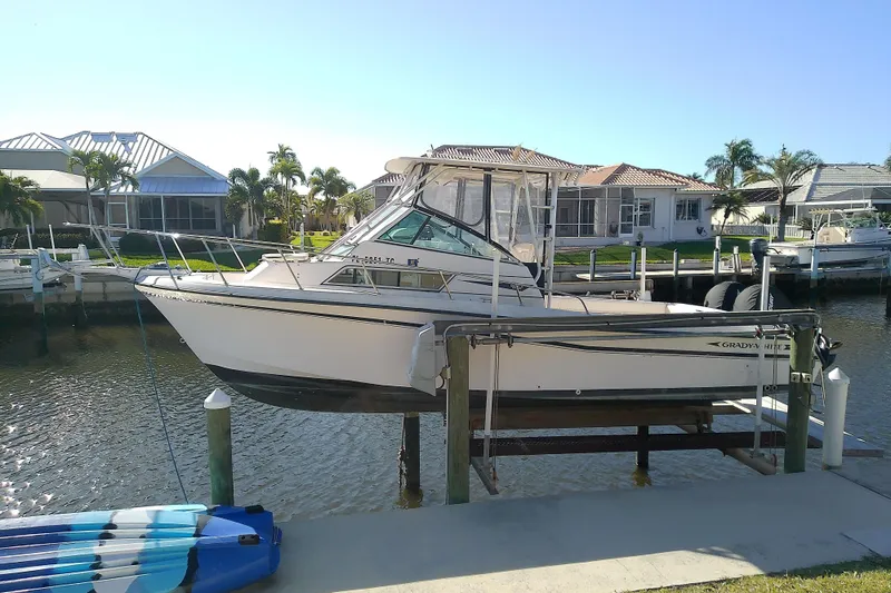 Slide: The Image of 1995 Grady-White Sailfish 272 boat docked near waterfront homes, sunny day. - 38
