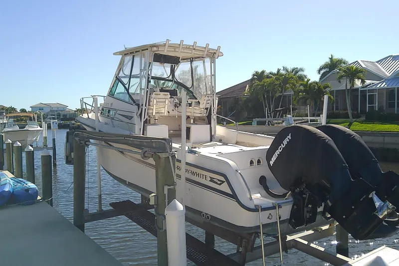 Slide: The Image of 1995 Grady-White Sailfish 272 boat docked with dual Mercury engines. - 4