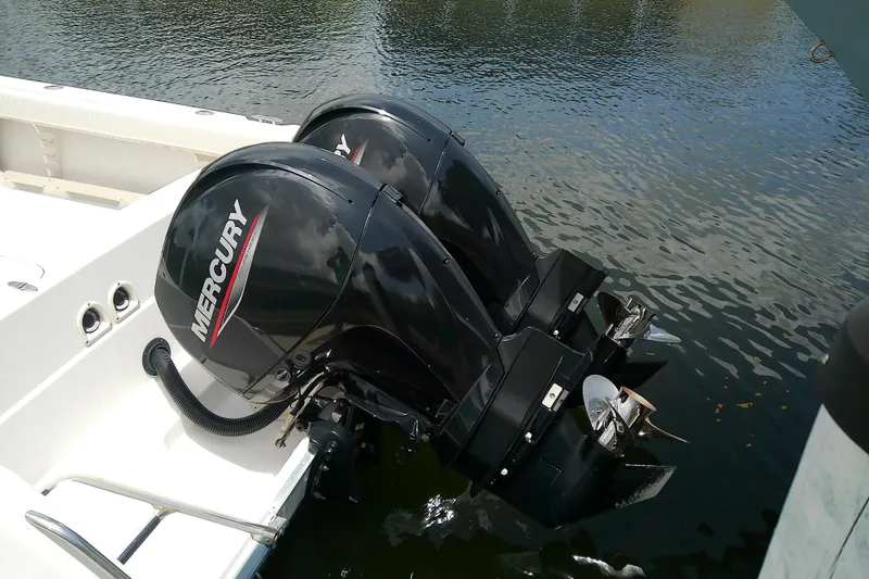 Slide: The Image of Twin Mercury outboard engines on a 1995 Grady-White Sailfish 272 boat. - 40