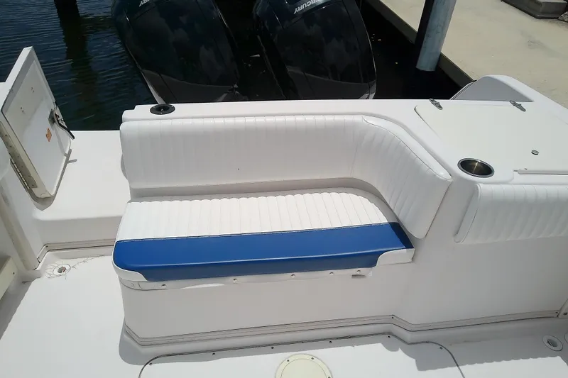 Slide: The Image of 1995 Grady-White Sailfish 272 boat interior with white and blue seating. - 43