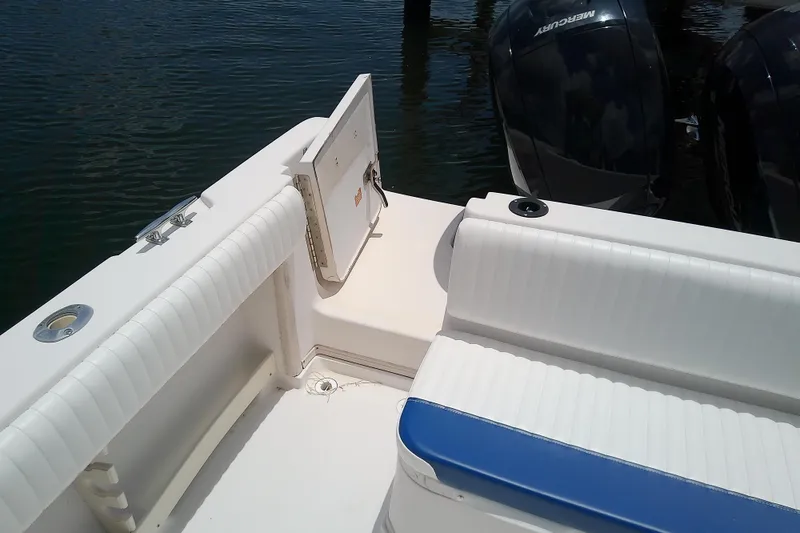 Slide: The Image of 1995 Grady-White Sailfish 272 boat interior with seating and dual Mercury outboard engines. - 44