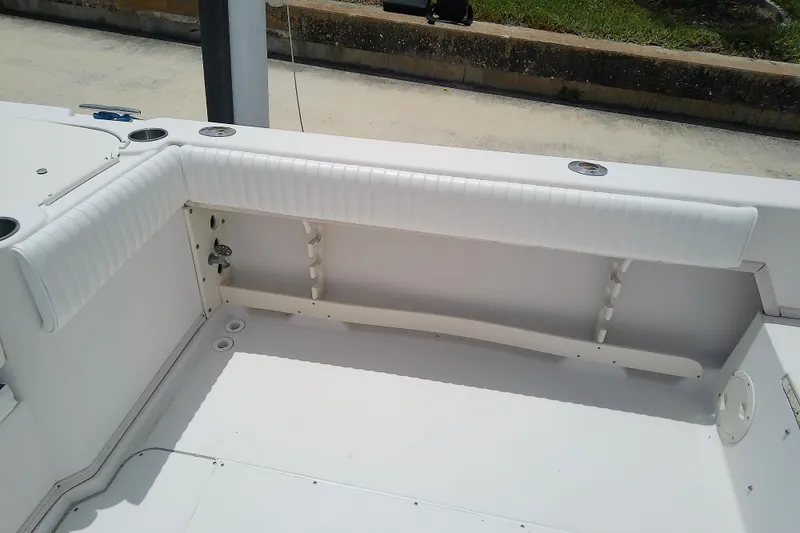 Slide: The Image of 1995 Grady-White Sailfish 272 boat interior with white cushioned seating. - 45