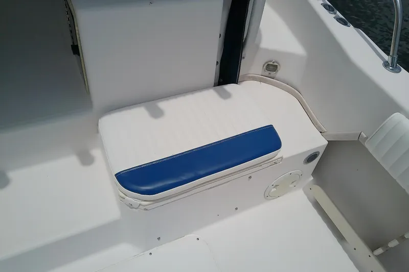 Slide: The Image of White and blue seating on 1995 Grady-White Sailfish 272 boat deck. - 47