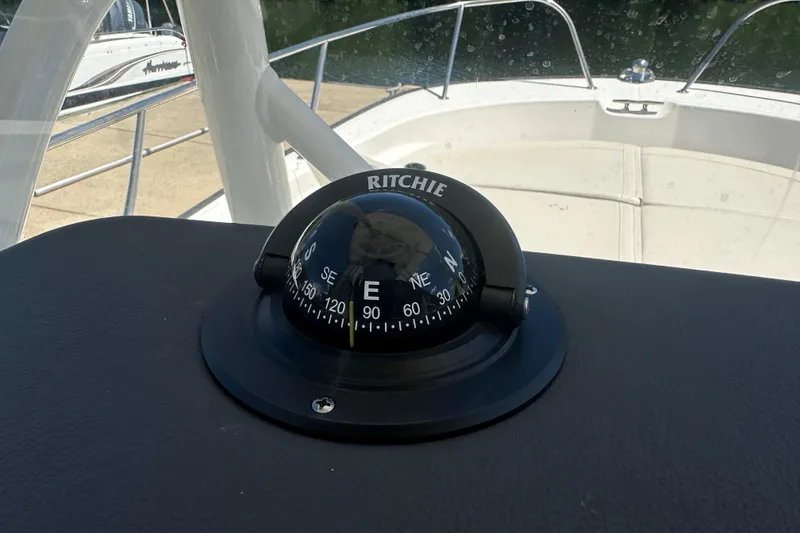 Slide: The Image of Compass on 2022 Boston Whaler 210 Montauk boat dashboard. - 13