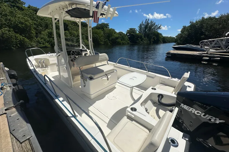 Slide: The Image of 2022 Boston Whaler 210 Montauk boat docked on a sunny day. - 3