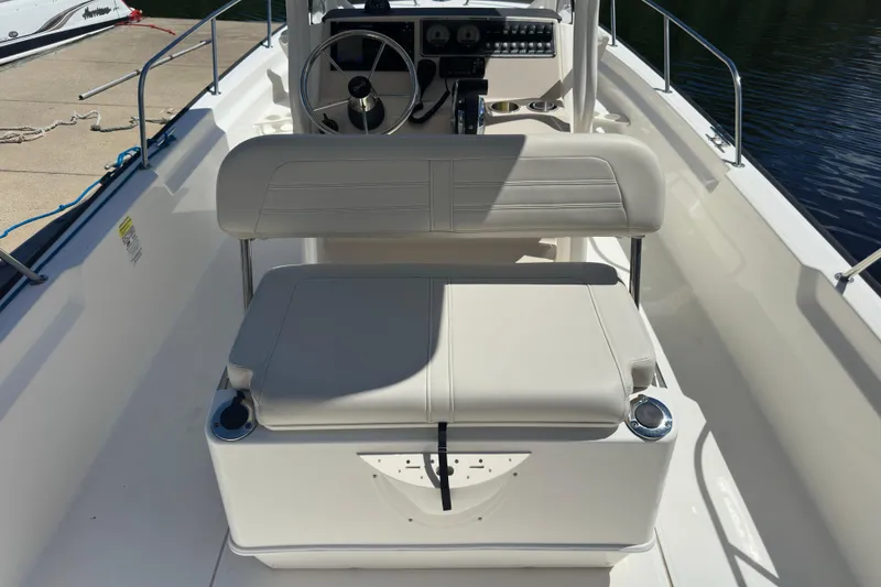 Slide: The Image of 2022 Boston Whaler 210 Montauk boat interior with steering console and seating. - 7