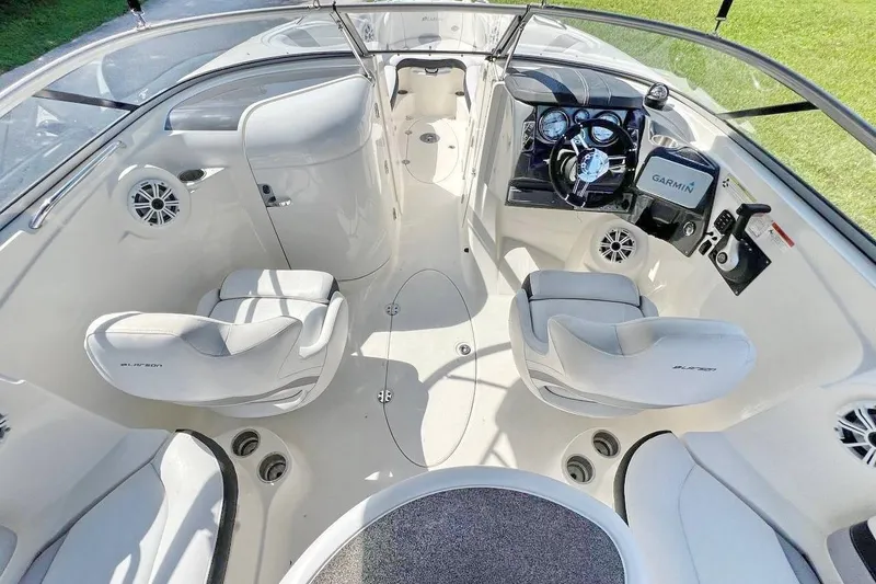 Slide: The Image of Interior of 2013 Larson LXi 292 IO boat with modern dashboard and seating. - 15