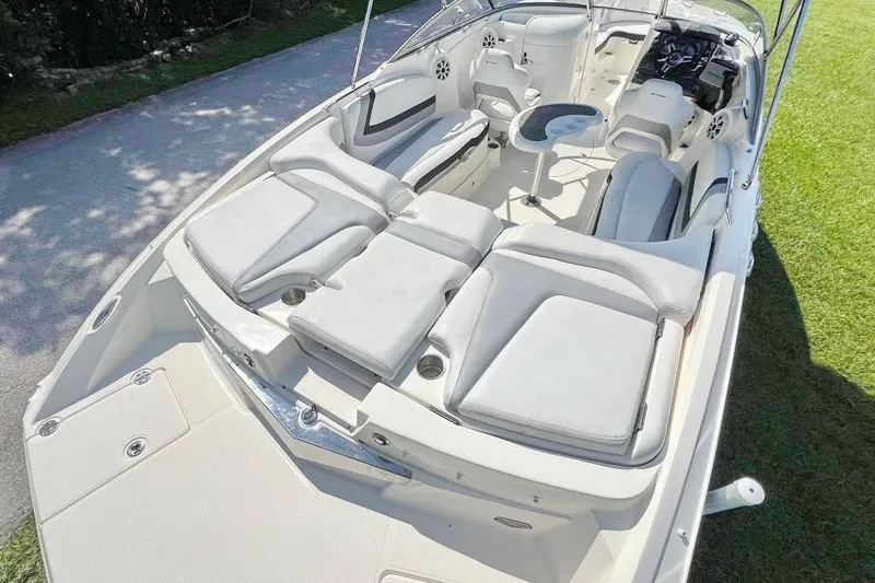 Slide: The Image of 2013 Larson LXi 292 IO boat interior with spacious seating and modern design. - 7