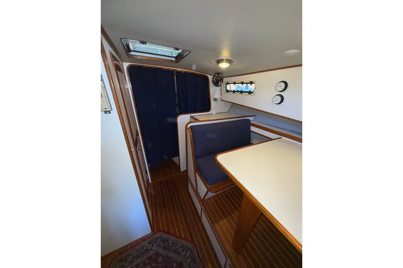 Slide: The Image of Interior of 1997 Norstar 301 boat with wooden flooring and seating area. - 16
