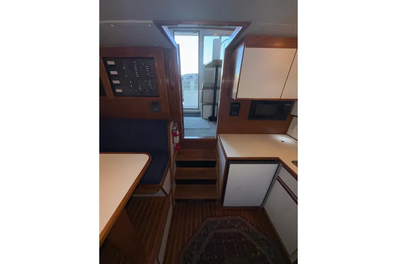 Slide: The Image of Interior of 1997 Norstar 301 boat with kitchen and control panel. - 18