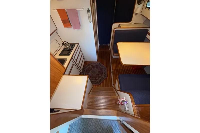 Slide: The Image of Interior of a 1997 Norstar 301 boat with kitchen and dining area. - 22