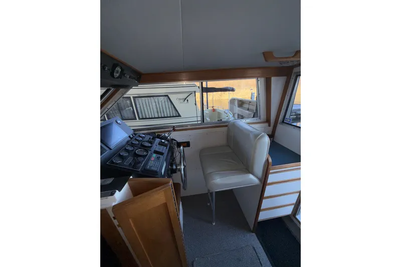 Slide: The Image of Interior of a 1997 Norstar 301 boat with helm and seating area. - 27