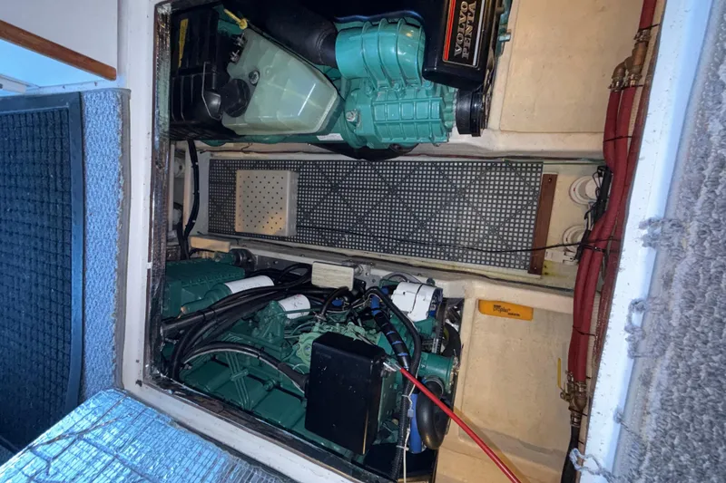 Slide: The Image of Engine compartment of a 1997 Norstar 301 boat, featuring Volvo Penta components. - 29