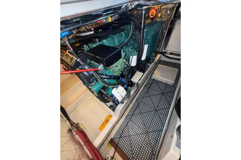 Slide: The Image of Engine compartment of a 1997 Norstar 301 boat, showcasing mechanical components. - 30