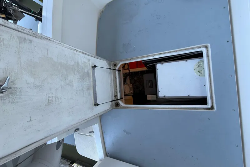 Slide: The Image of 1997 Norstar 301 boat interior with open hatch and visible equipment. - 5