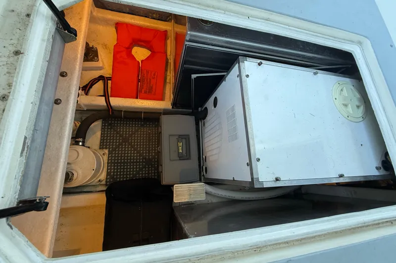 Slide: The Image of 1997 Norstar 301 boat compartment with equipment and safety gear. - 6