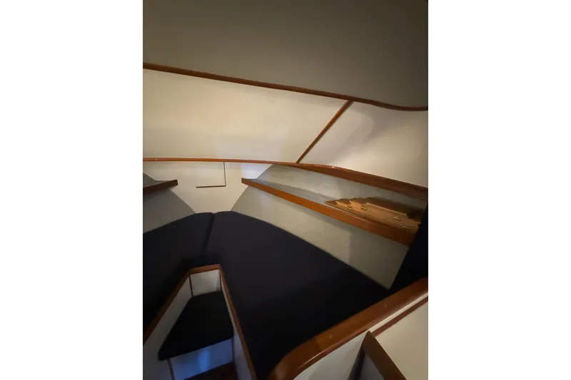 Slide: The Image of Interior cabin of 1997 Norstar 301 boat with wooden trim and seating. - 9