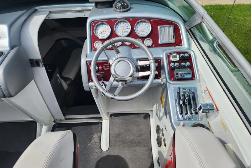 Slide: The Image of 2008 Formula 292 FASTech boat cockpit with steering wheel and control panel. - 6