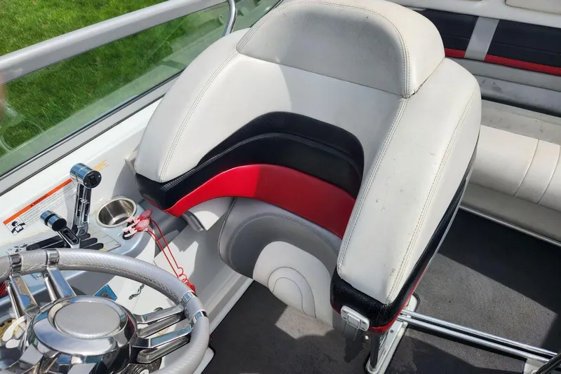 Slide: The Image of 2008 Formula 292 FASTech boat interior with steering wheel and seat detail. - 8
