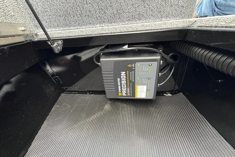 Slide: The Image of Battery compartment of 2026 Lund 1700 Explorer SS with Minn Kota Precision charger. - 14