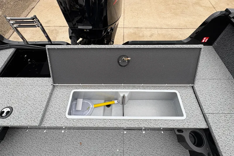 Slide: The Image of 2026 Lund 1700 Explorer SS boat with open storage compartment and motor. - 25