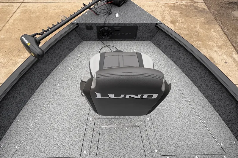Slide: The Image of 2026 Lund 1700 Explorer SS boat interior with a single seat and trolling motor. - 8