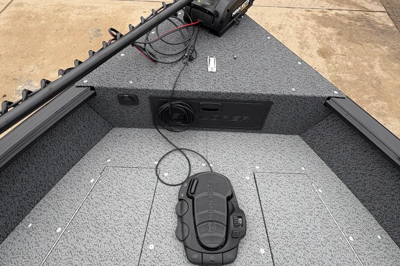 Slide: The Image of 2026 Lund 1700 Explorer SS boat interior with Minn Kota trolling motor. - 9