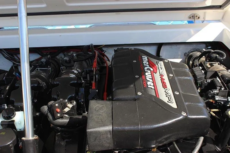 Slide: The Image of Engine compartment of a 2000 Fountain 32 Fever boat, featuring a MerCruiser engine. - 18