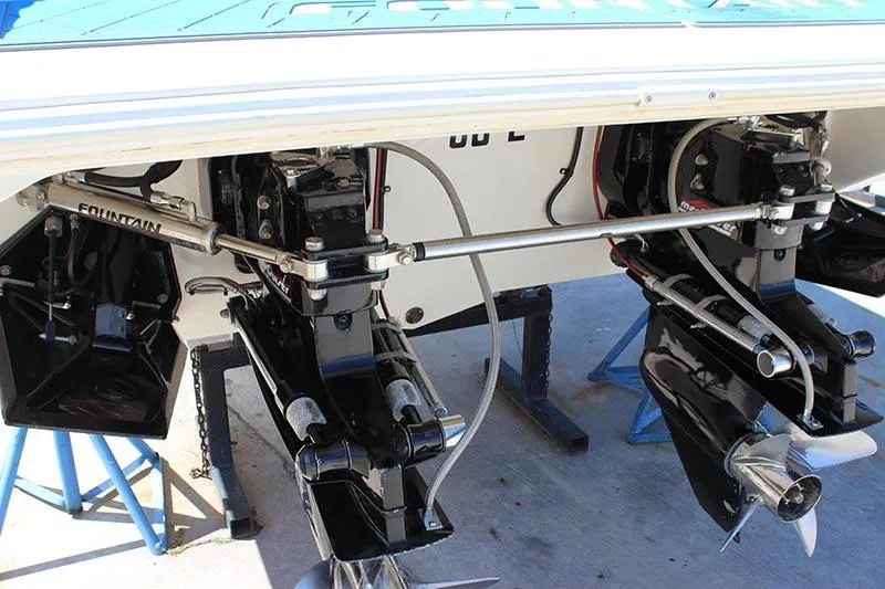 Slide: The Image of 2000 Fountain 32 Fever boat with dual outboard motors on stands. - 23