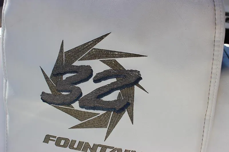 Slide: The Image of Fountain 32 Fever 2000 logo on white upholstery, featuring bold design elements. - 6